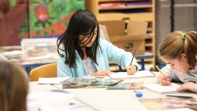 Youth in a studio drawing and painting