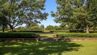 Stone terraced amphitheater with three grassy levels in a beautiful natural setting. 